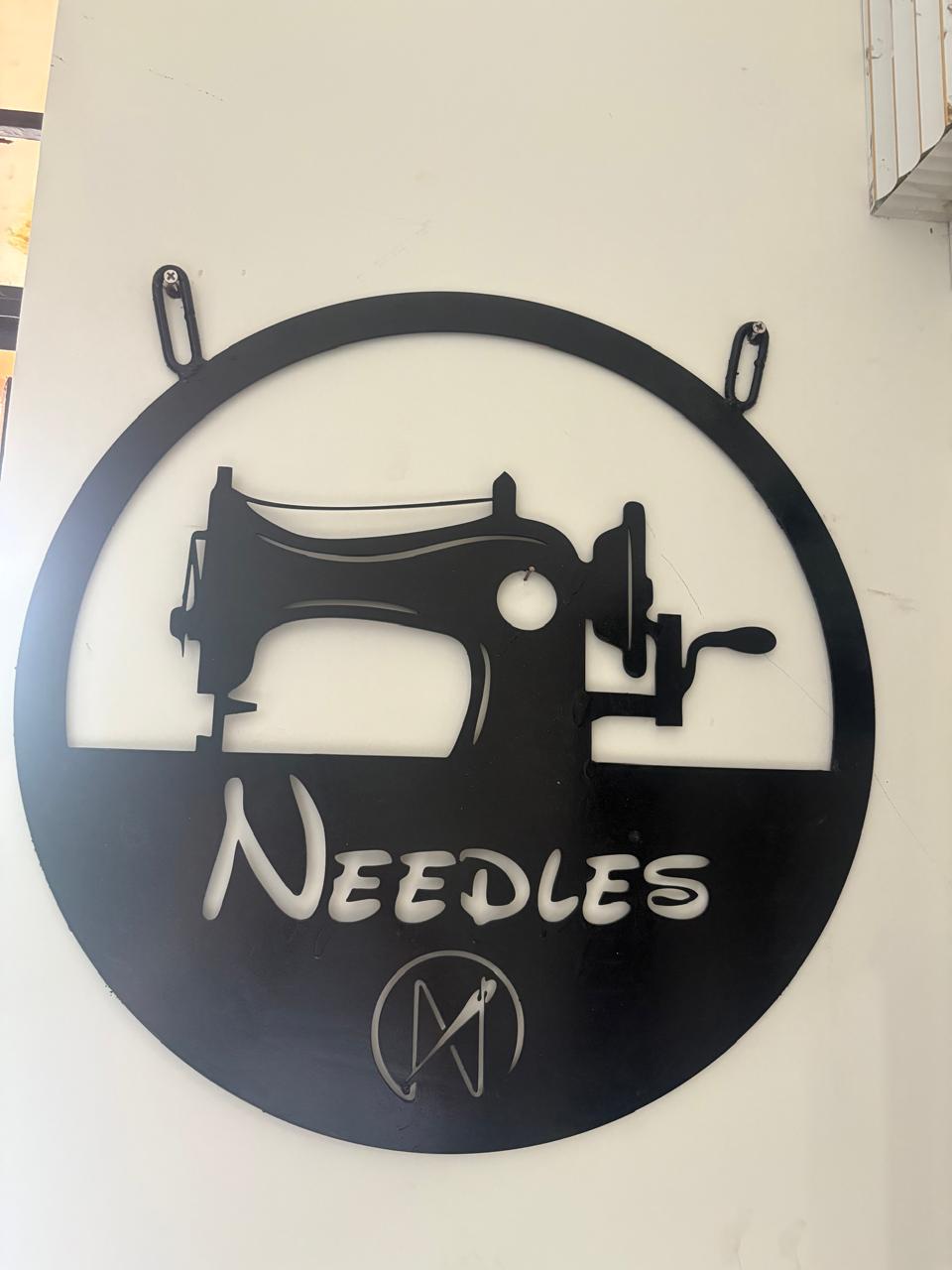 fashion design mood board with fabric swatches, sketches, and antique sewing tools