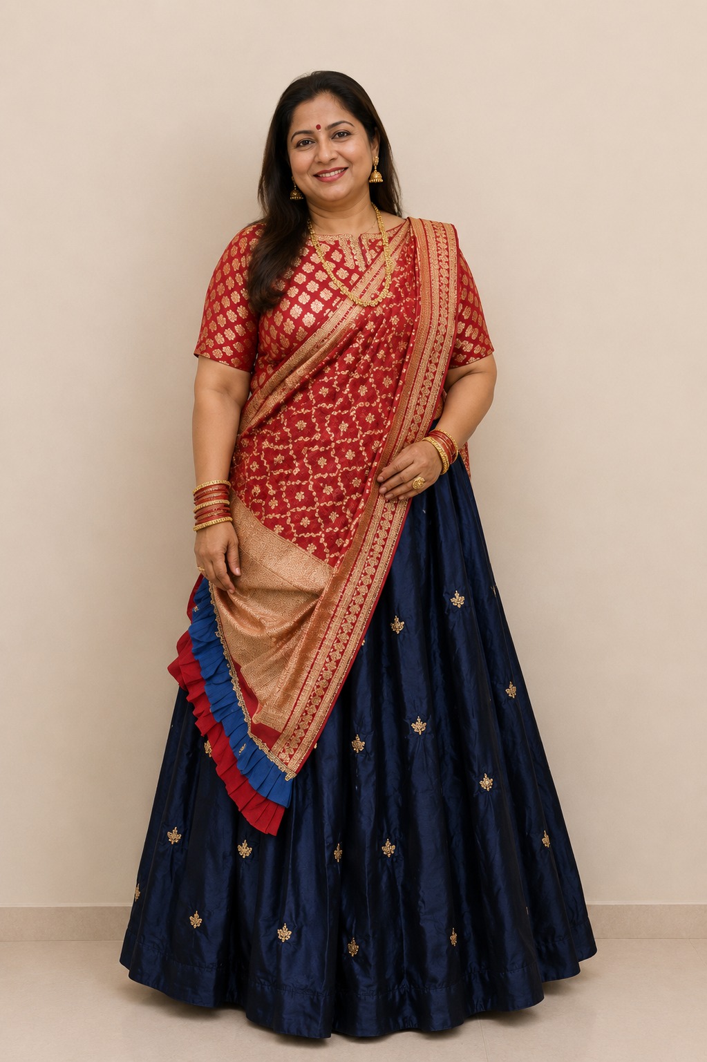 boy in smart casual navy cashmere sweater and olive green trousers leaning against a stone wall